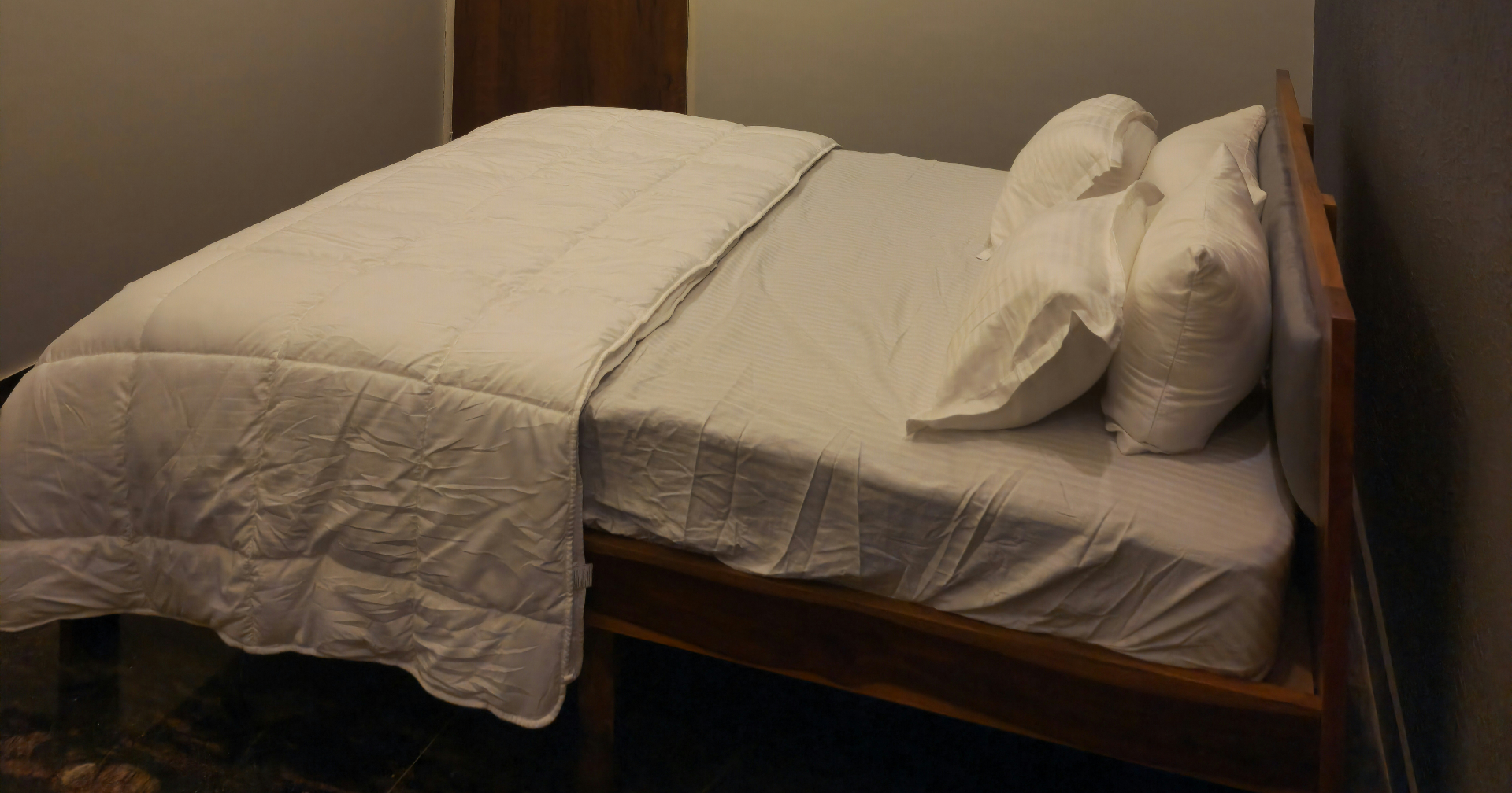 Side view of boutique room with premium bedding