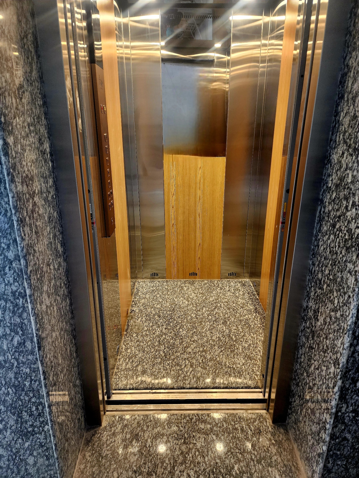 Modern guest elevator with granite finish