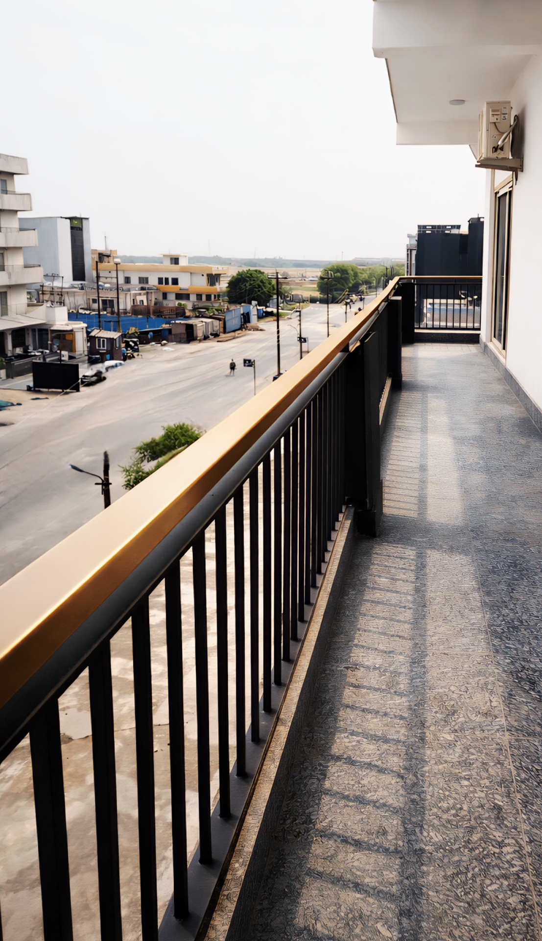 Balcony view across the Noida Expressway corridor